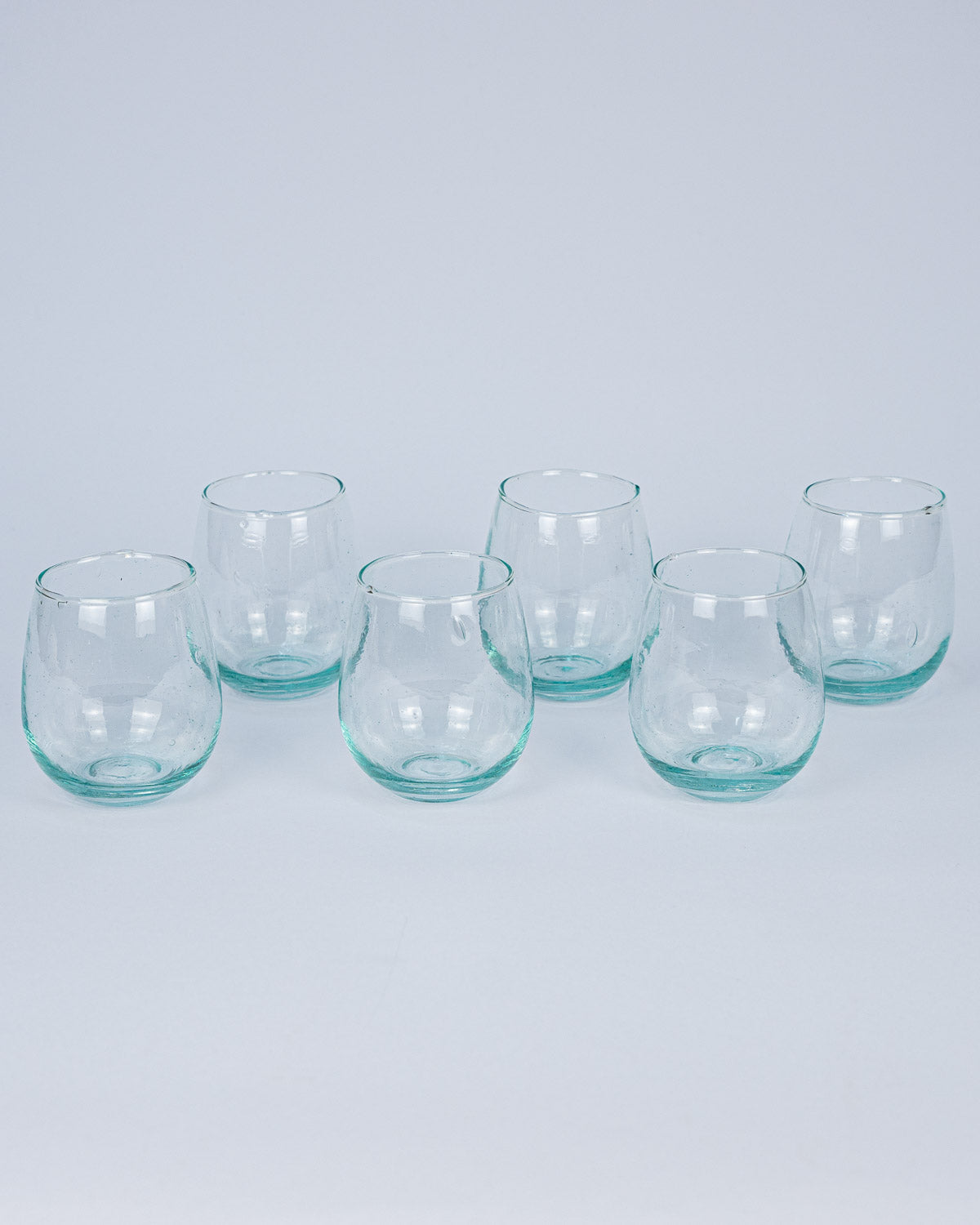 Designer Trink Glas - mundgeblasen, transparent, handgemacht aus recyceltem Glas - bei MOGADOR kaufen